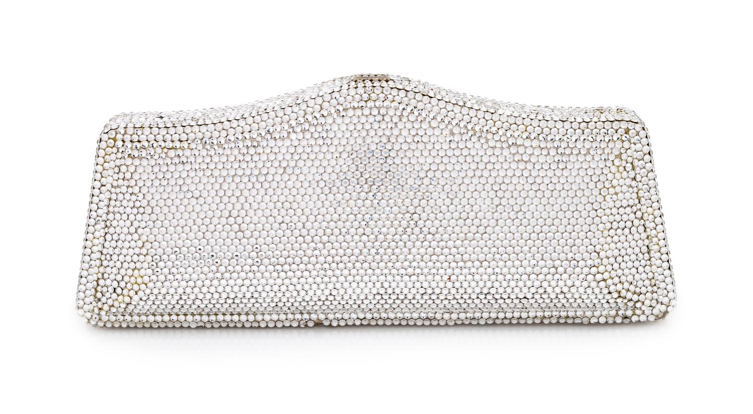 A Judith Leiber Silver Crystal Minaudiere, 3.5" H x 8" W x 1.25" D.