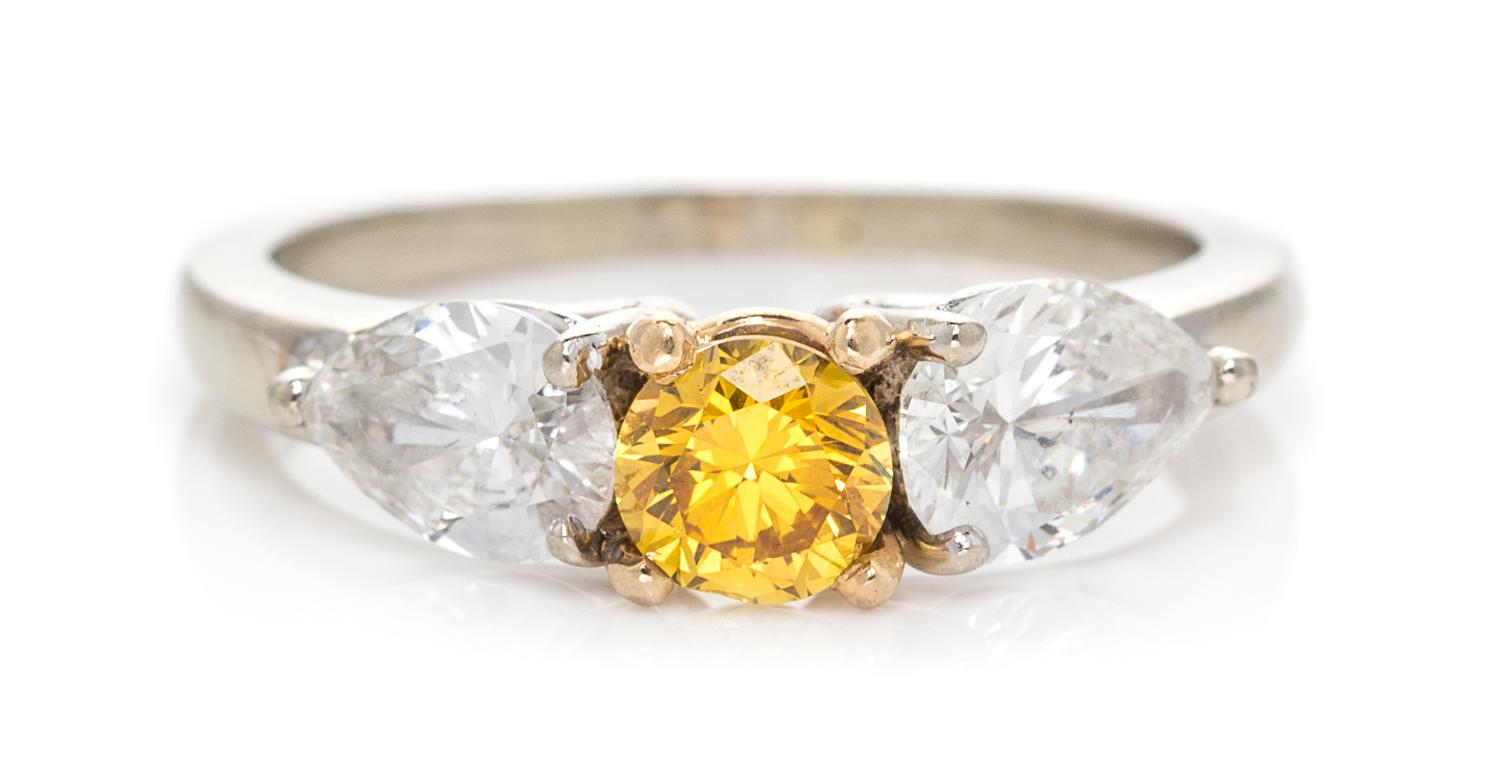 A Bicolor Gold, Fancy Vivid Yellow Diamond and Diamond Ring, 2.30 dwts.
