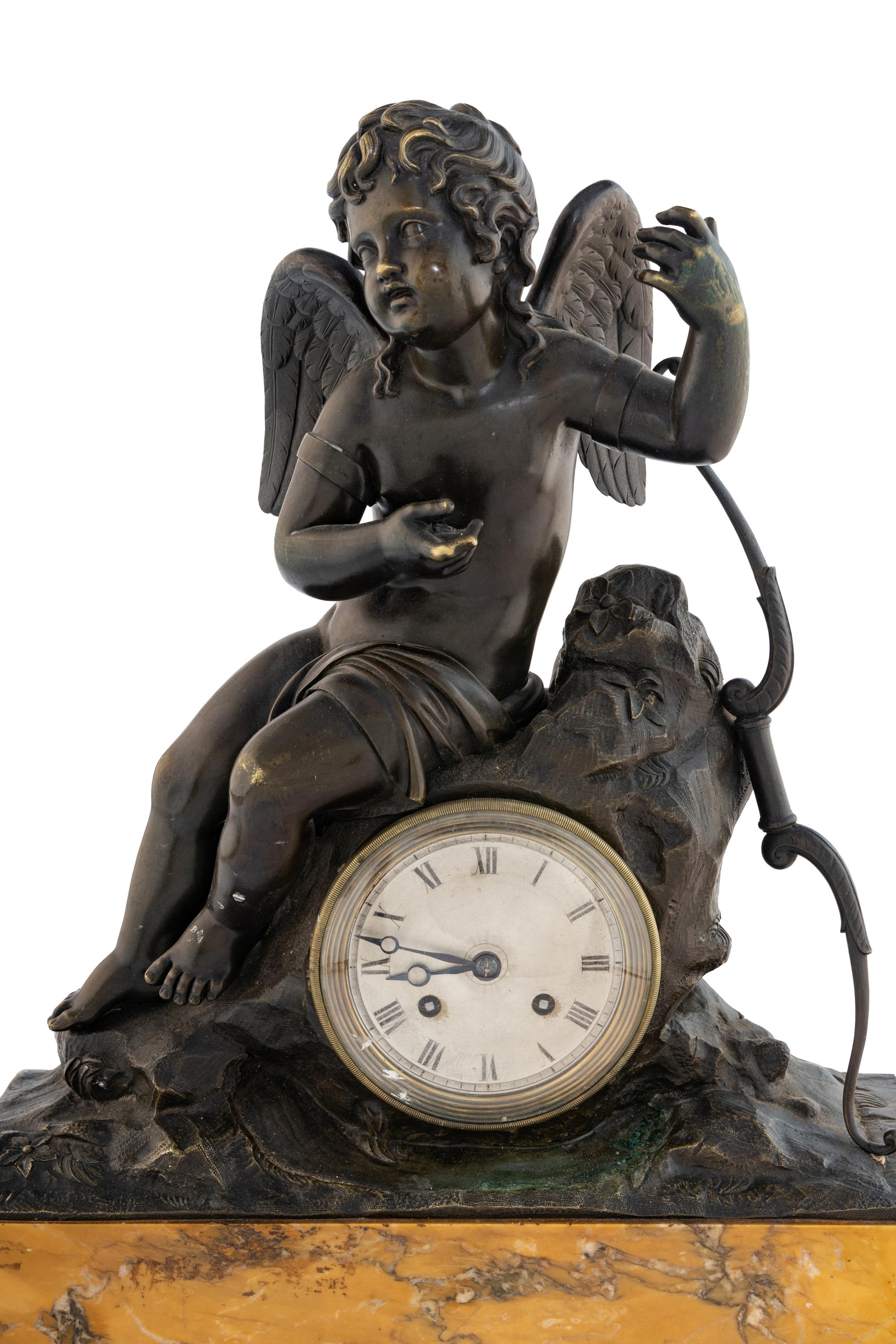 A Louis Philippe Bronze and Marble Figural Clock