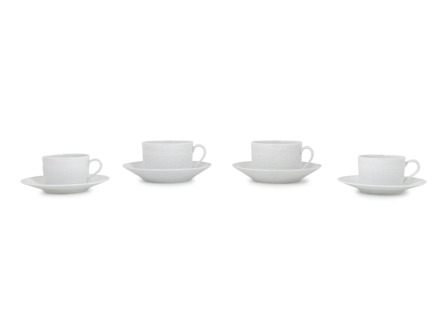 A Group of Hermès Egée Porcelain Cups and Saucers
