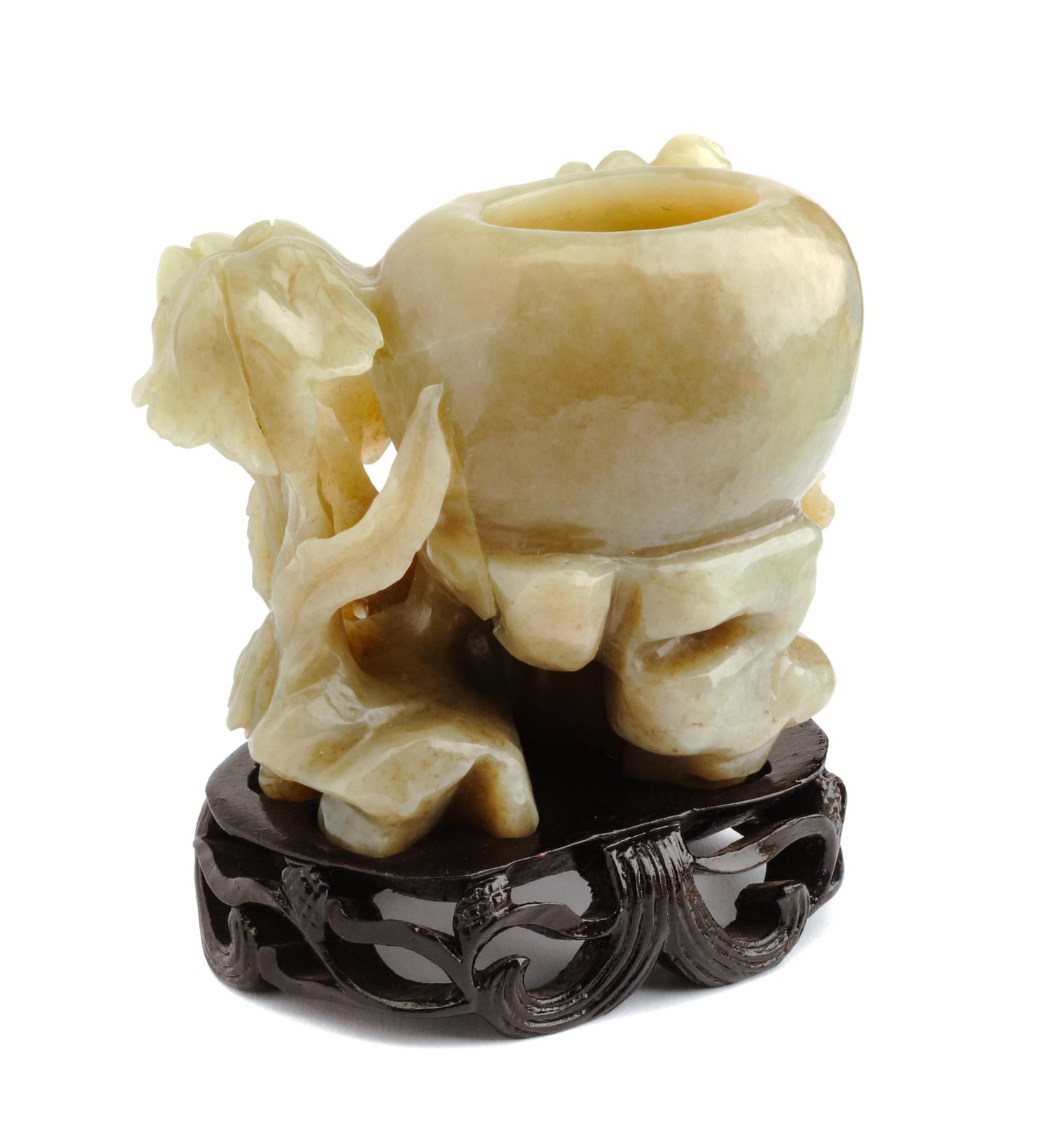 A Carved Celadon Jadeite Vessel Height 3 1/2 inches.
