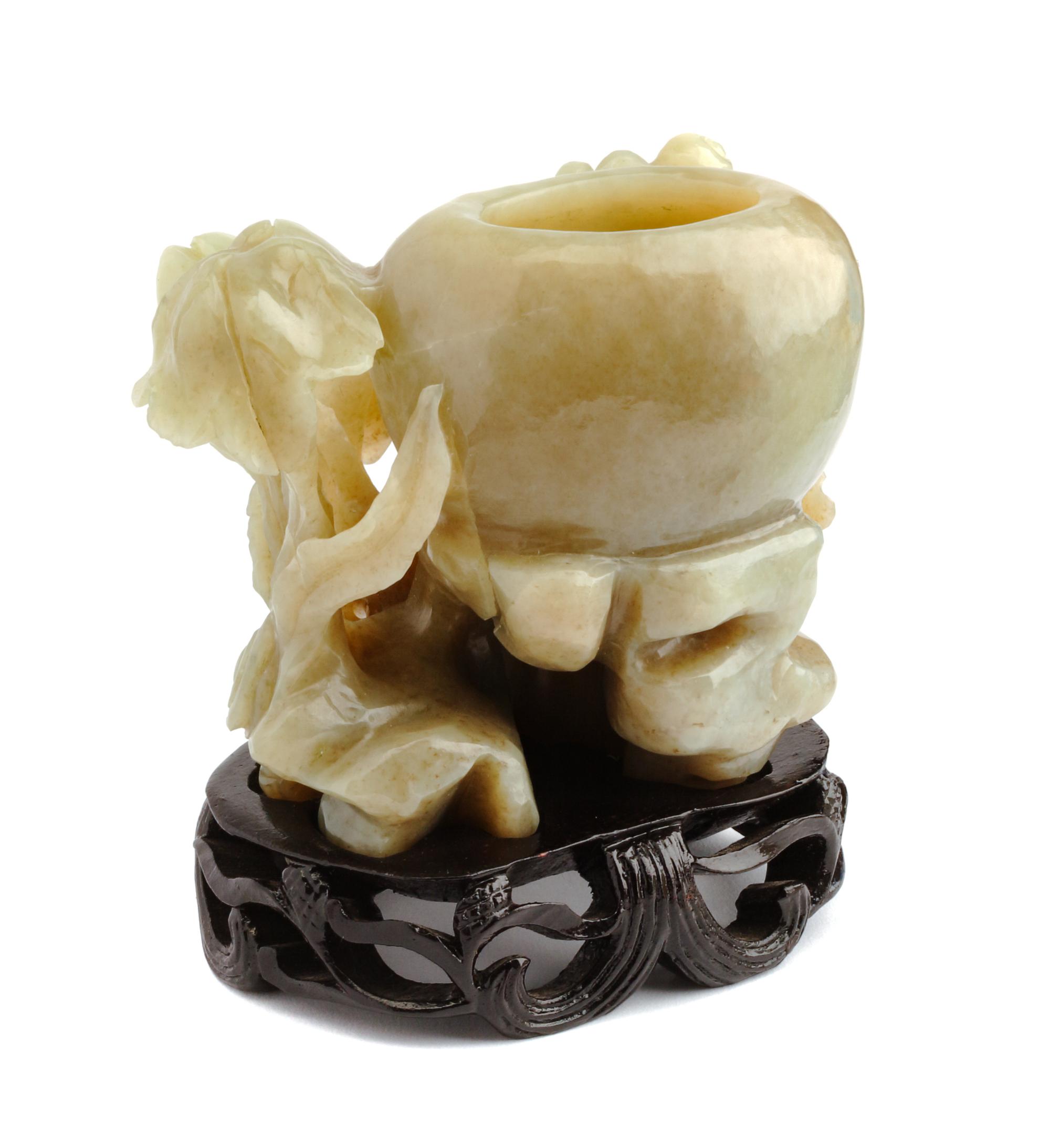 A Carved Celadon Jadeite Vessel Height 3 1/2 inches.