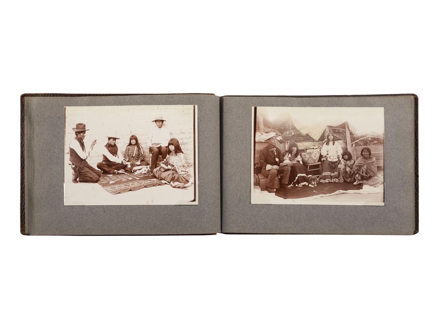 [NATIVE AMERICANS]. JONES, John Edward (1863-1922), photographer. Album containing 50 photographs of the San Carlos Indian Agency, including Apache civilians and police, agency buildings and dwellings, and scenic views. Ca 1904.