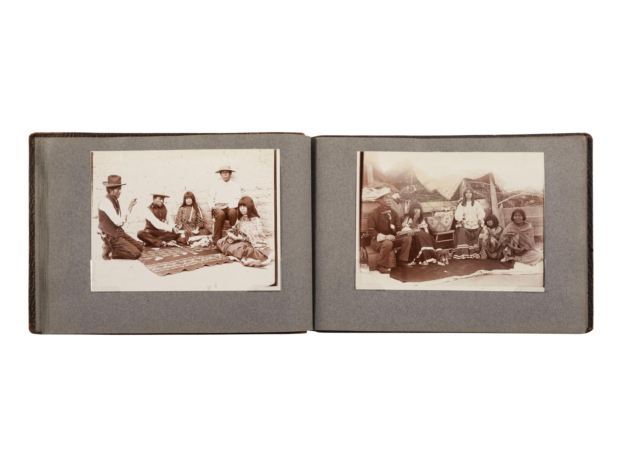 [NATIVE AMERICANS]. JONES, John Edward (1863-1922), photographer. Album containing 50 photographs of the San Carlos Indian Agency, including Apache civilians and police, agency buildings and dwellings, and scenic views. Ca 1904.