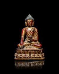 A Tibetan/Nepalese Gilt and Red Lacquered Bronze Figure of Buddha