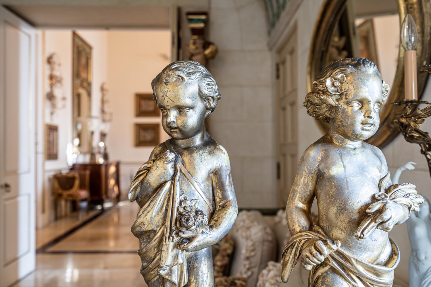 A Pair of Continental Giltwood Figures of Putti