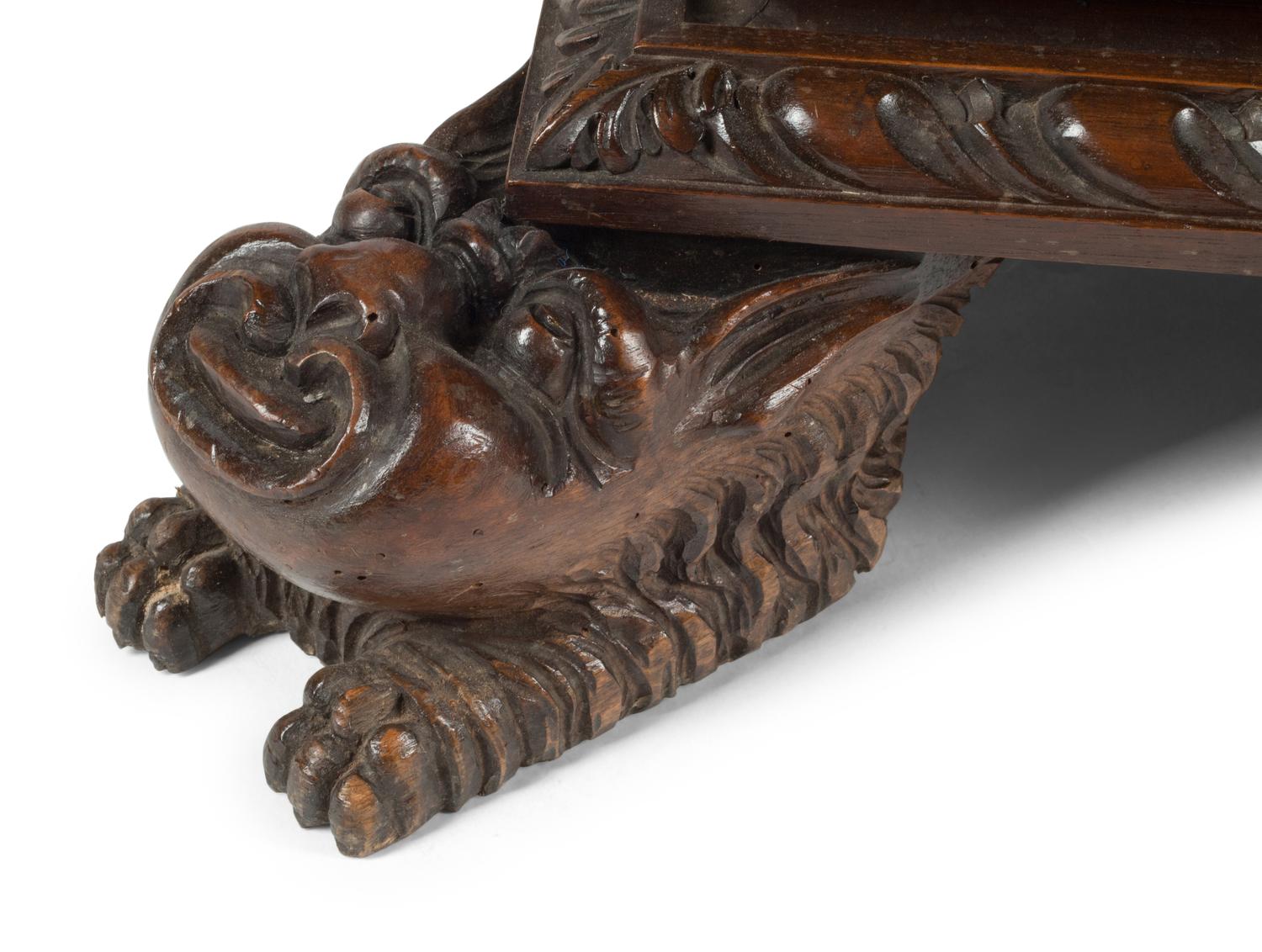 An Italian Renaissance Revival Carved Walnut Chest of Drawers