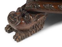 An Italian Renaissance Revival Carved Walnut Chest of Drawers