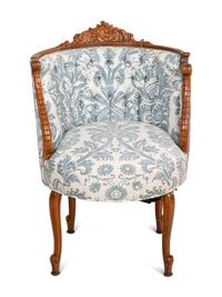 A Rococo Revival Carved Walnut Armchair