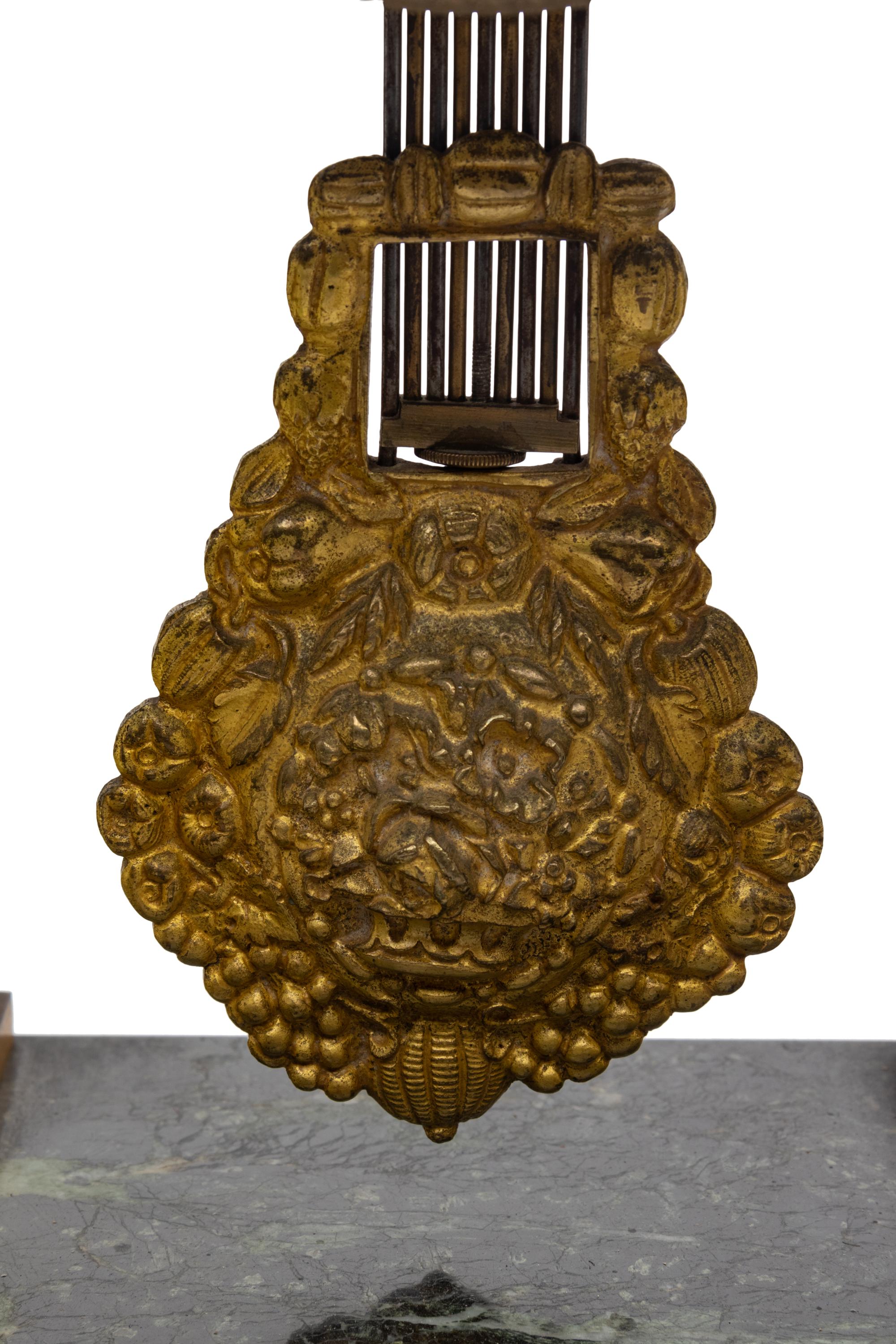 An Empire Style Gilt Bronze Mounted Marble Portico Clock