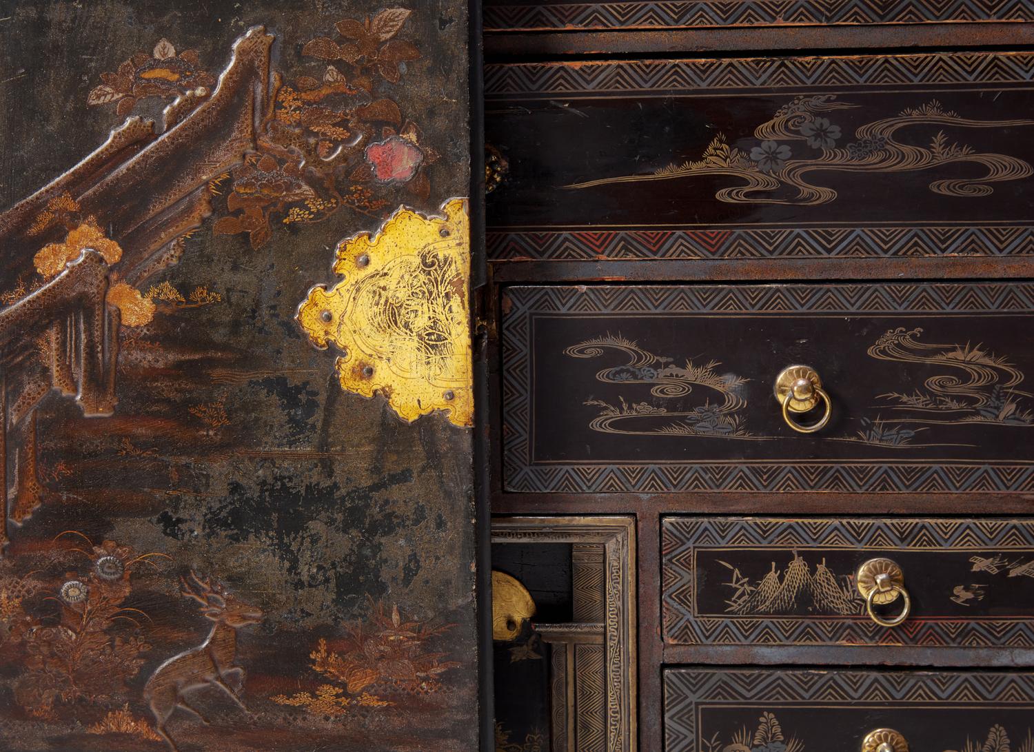 A George III Parcel Gilt Japanned Cabinet on Stand