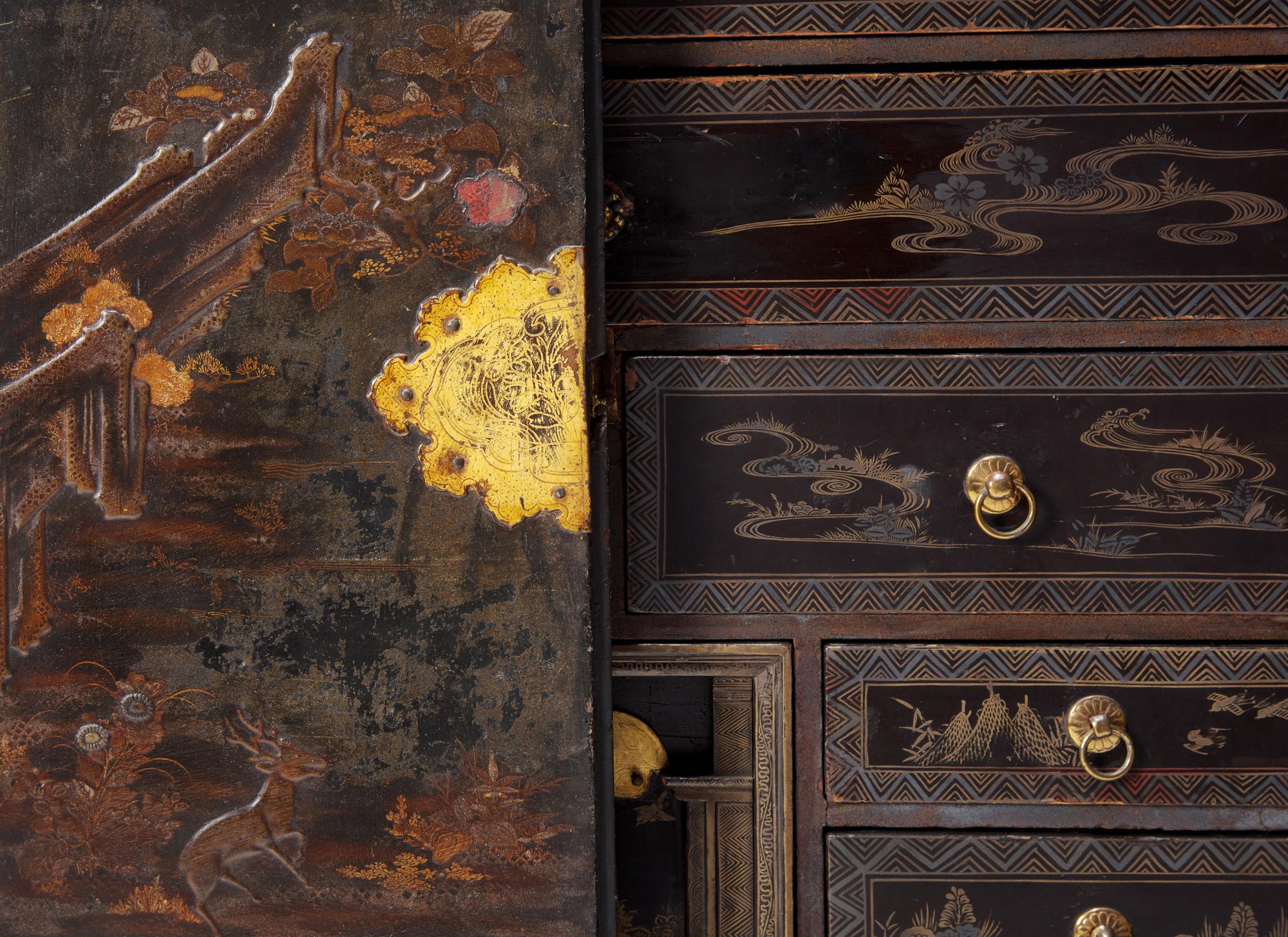 A George III Parcel Gilt Japanned Cabinet on Stand
