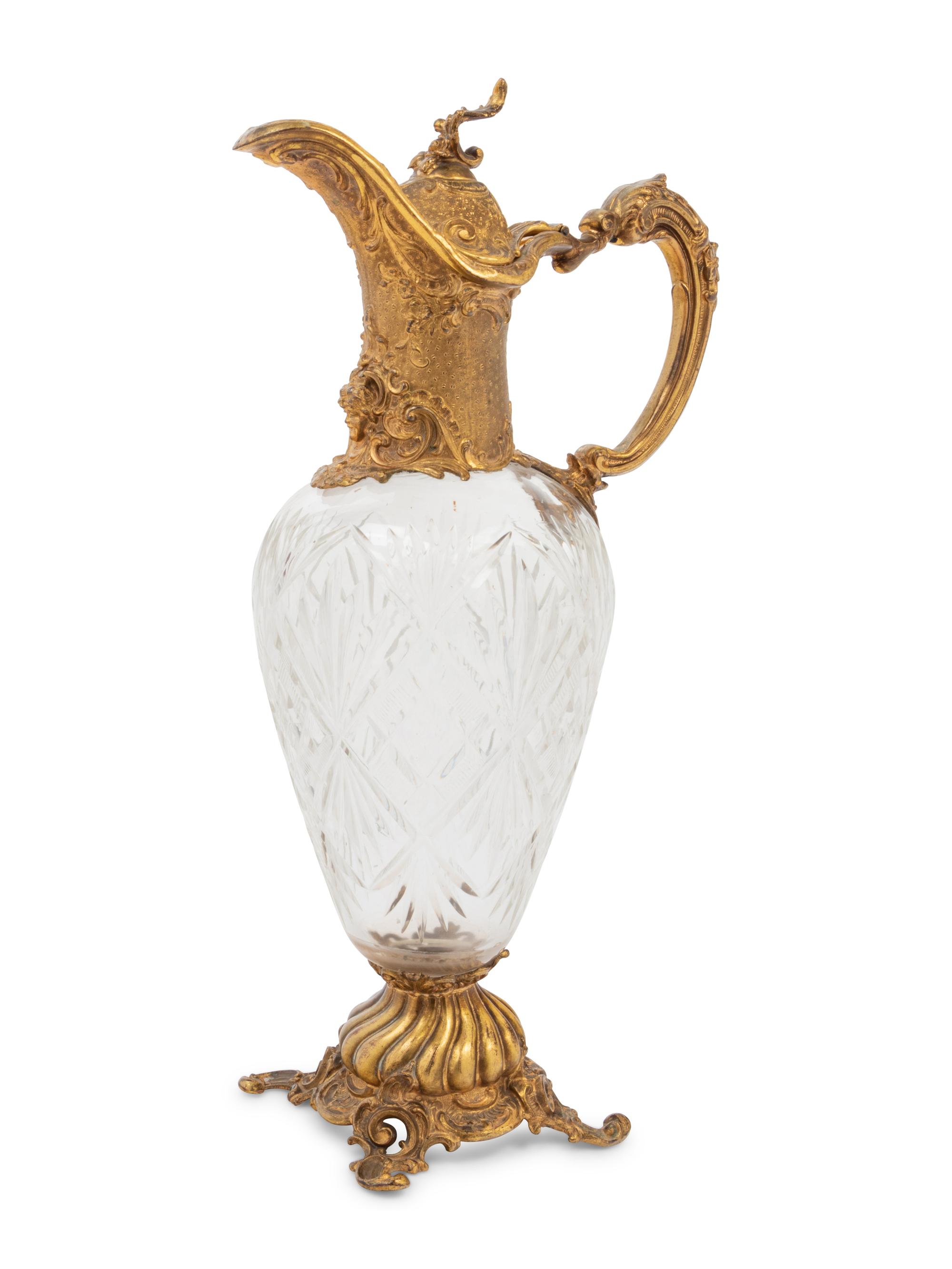 A Gilt Metal Mounted Cut Glass Claret Jug