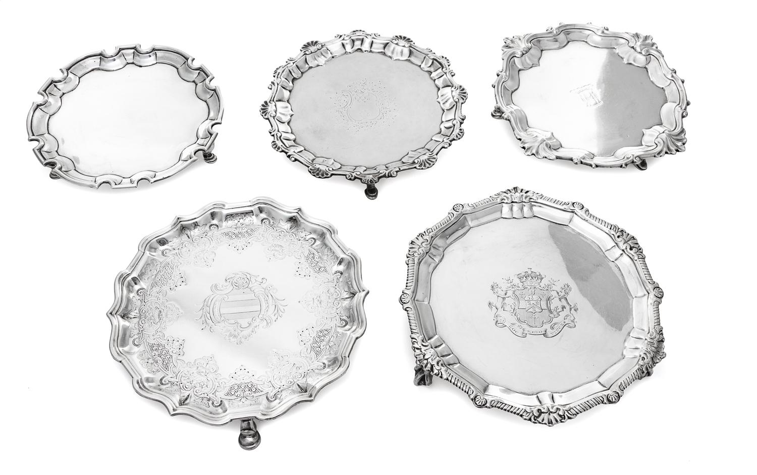 Five George II Silver Waiters, Various makers, 18th Century, comprising an Irish example with a gadroon and rocaille decorated rim the