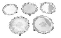 Five George II Silver Waiters, Various makers, 18th Century, comprising an Irish example with a gadroon and rocaille decorated rim the