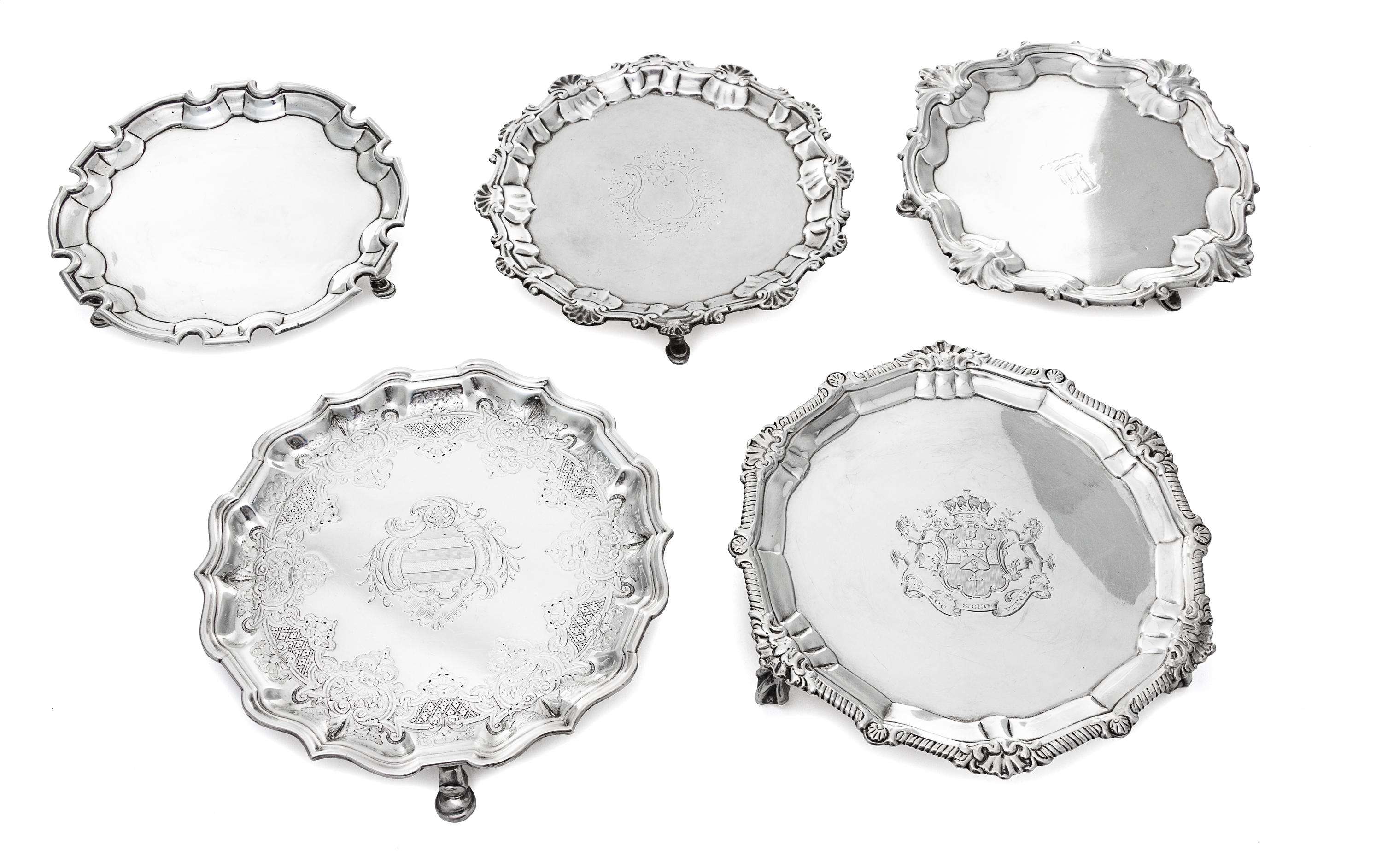 Five George II Silver Waiters, Various makers, 18th Century, comprising an Irish example with a gadroon and rocaille decorated rim the