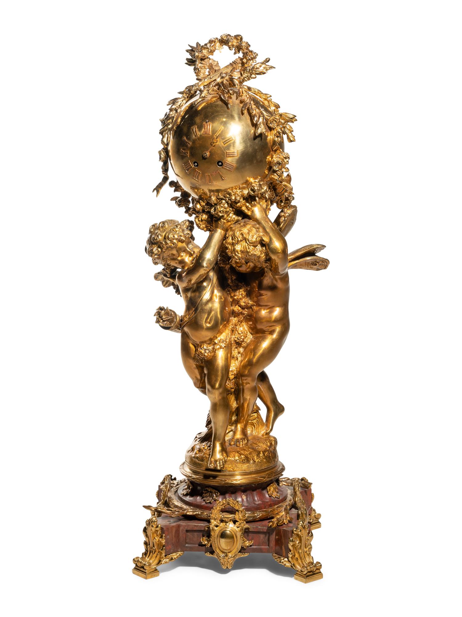A French Gilt Bronze and Marble Figural Clock