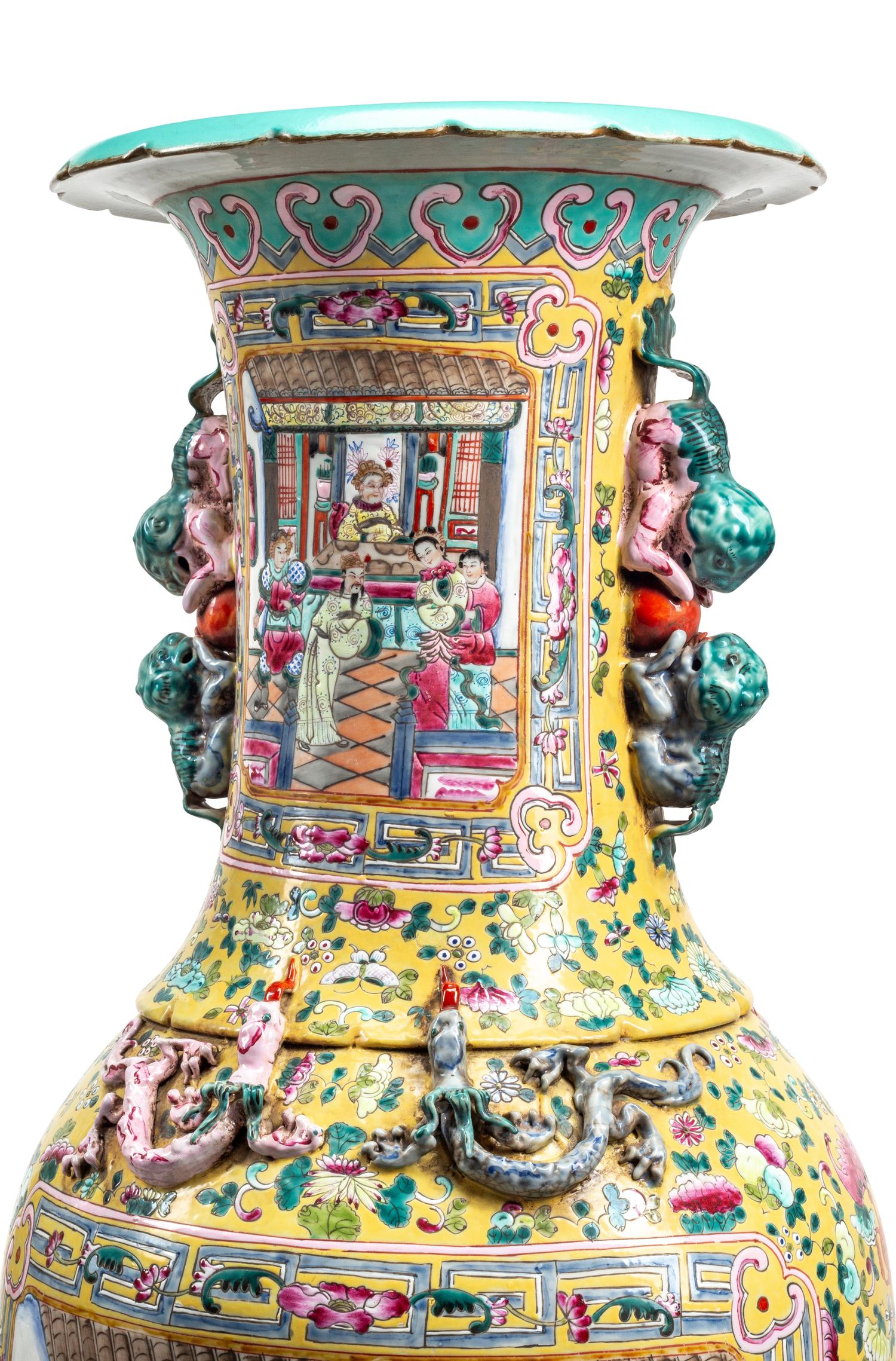 A Pair of Monumental Famille Jaune Porcelain Vases on Giltwood Stands