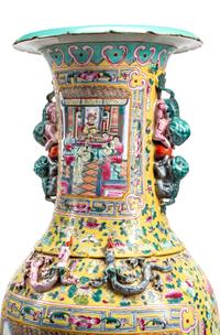 A Pair of Monumental Famille Jaune Porcelain Vases on Giltwood Stands