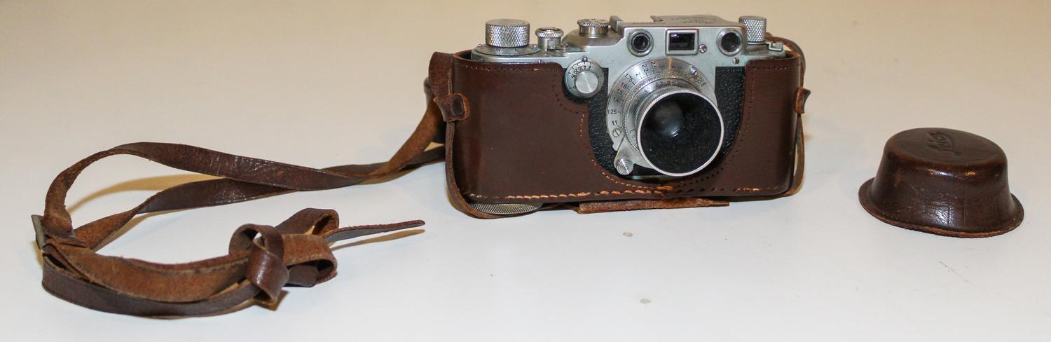 A Leica Camera Width of leather case 6 1/8 inches. — MID-20TH CENTURY