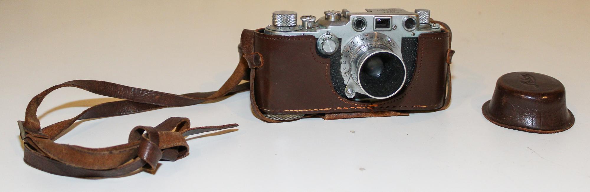 A Leica Camera Width of leather case 6 1/8 inches. — MID-20TH CENTURY