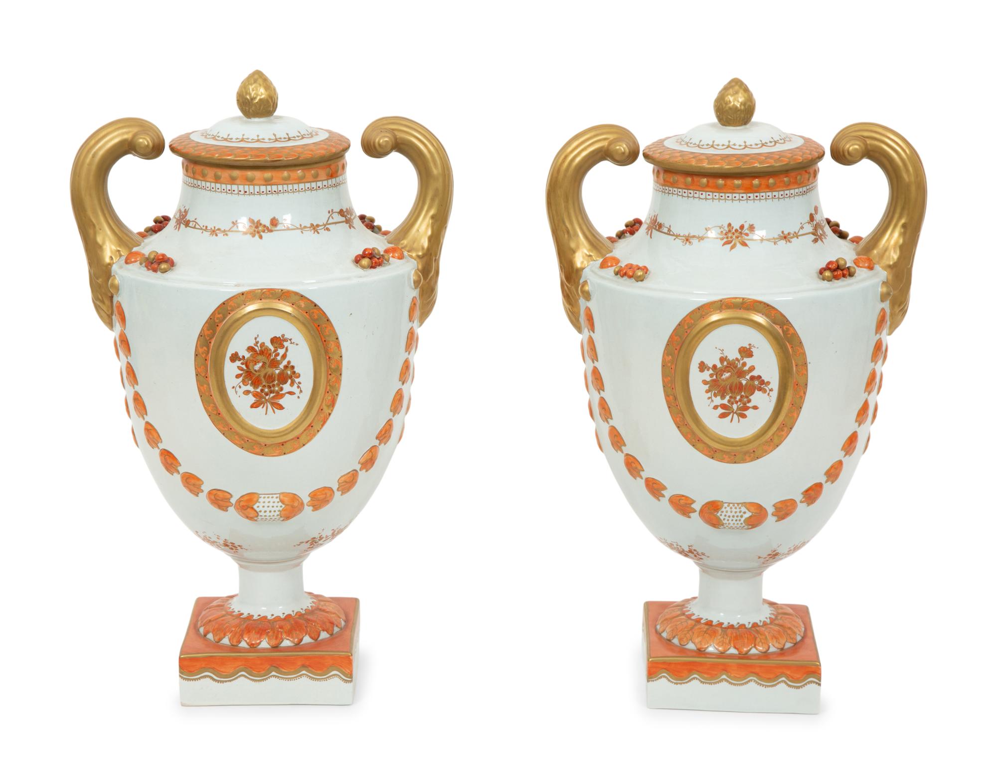 A Pair of Neoclassical Style Porcelain Urns with Bell Flower Swags
