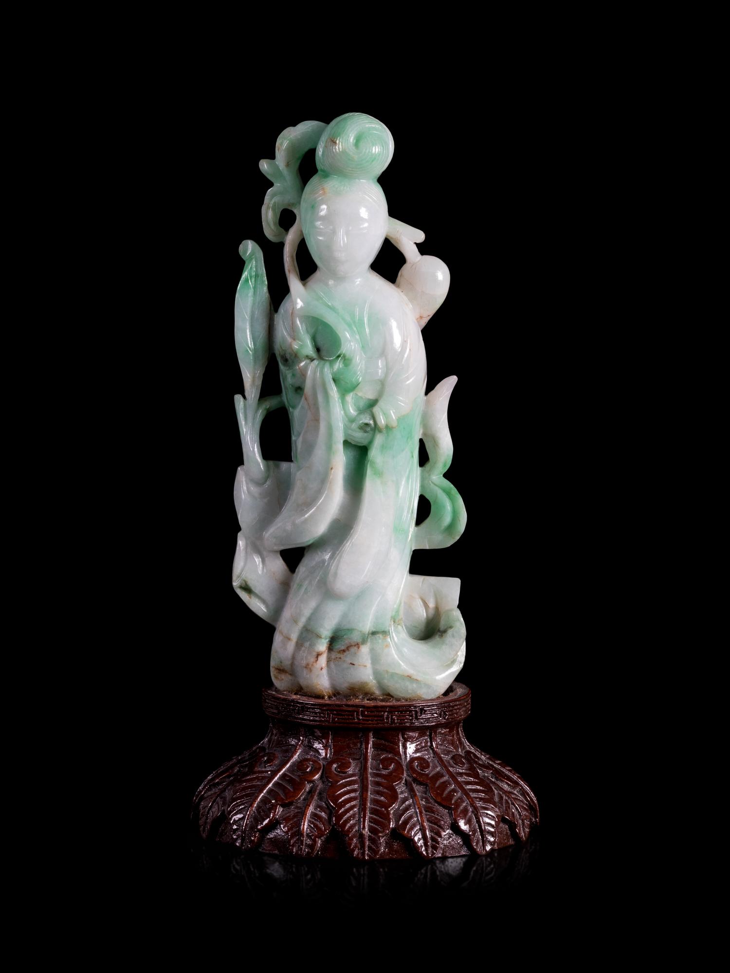 An Apple Green and White Jadeite Figure of a Lady Immortal