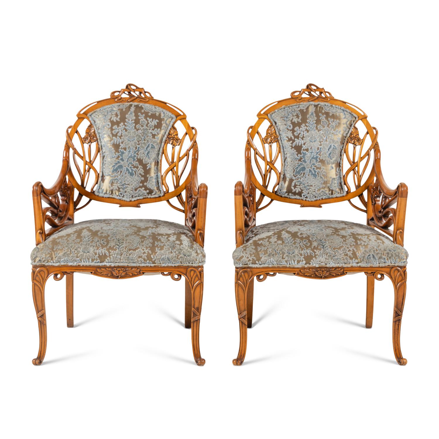 A Pair of Art Nouveau Style Carved Fruitwood Armchairs