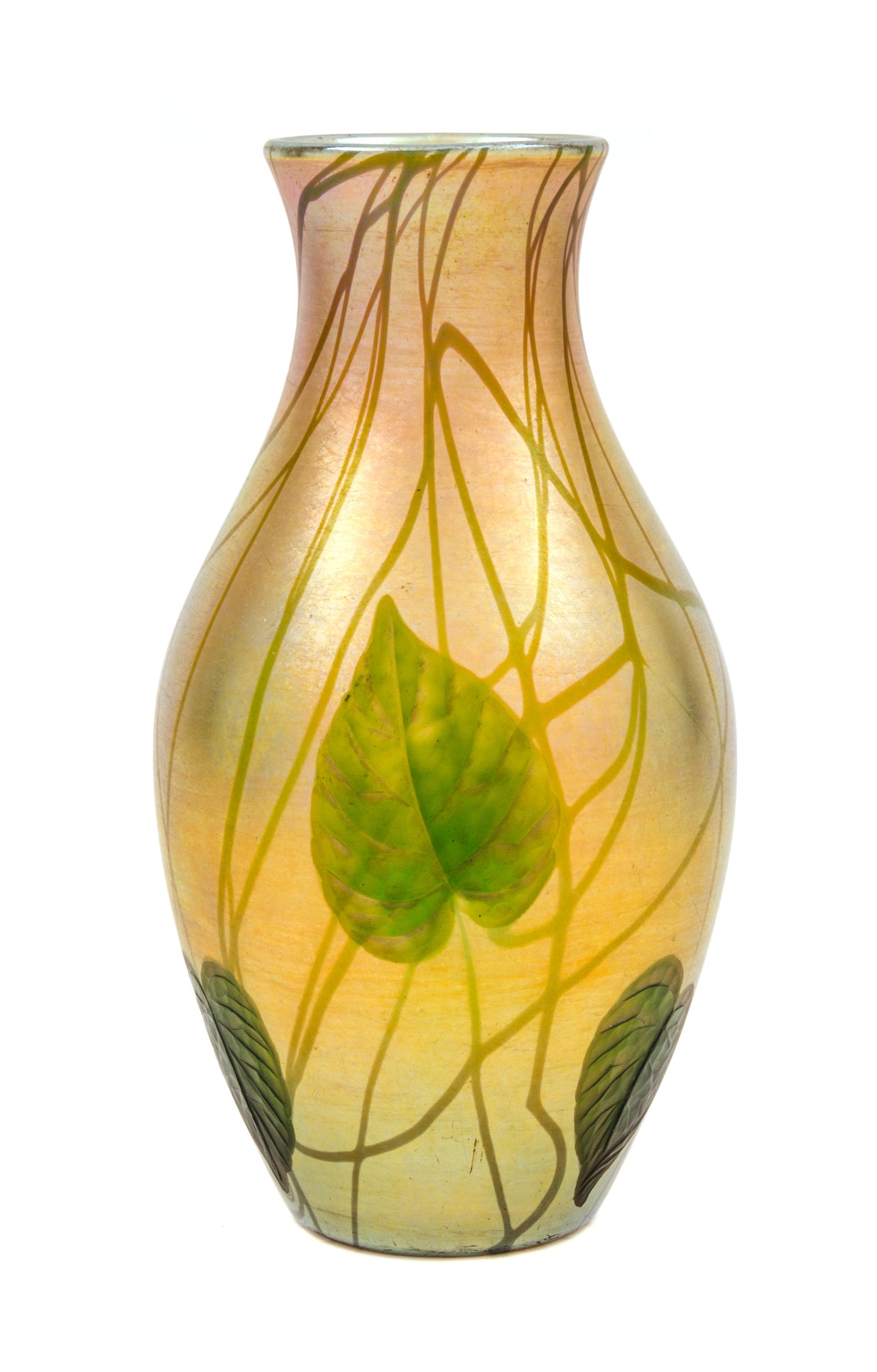 A Tiffany Intaglio Cut Favrile Vase Height 8 7/8 inches.