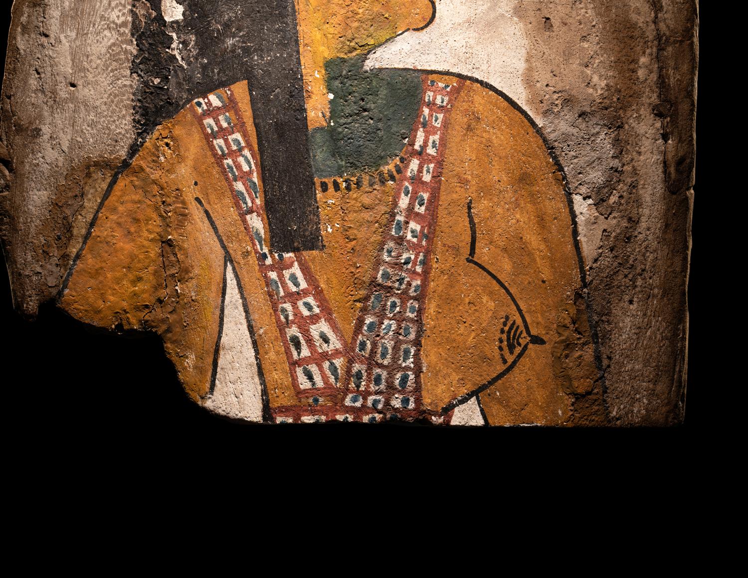 An Egyptian Polychrome Wood Fragment of a Sarcophagus with Isis