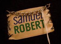 A Samuel Robert Black Leather and Animal Print Coat,