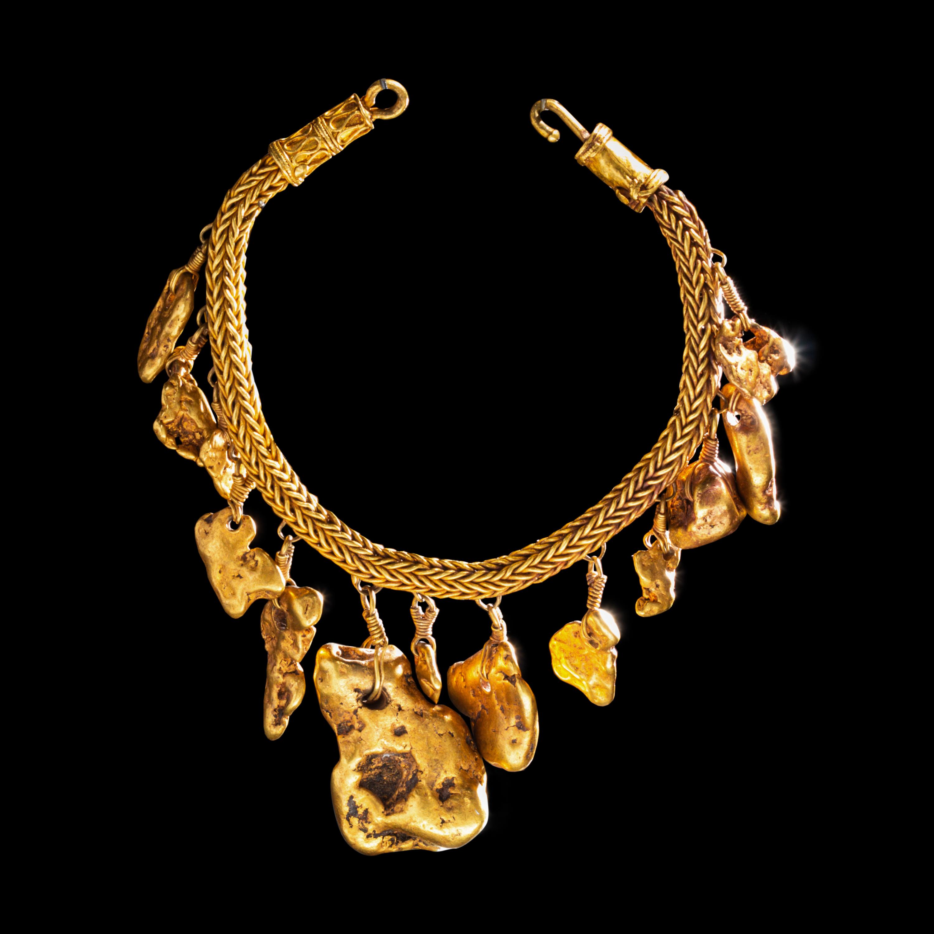 A Greek Gold Bracelet with Nugget Pendants