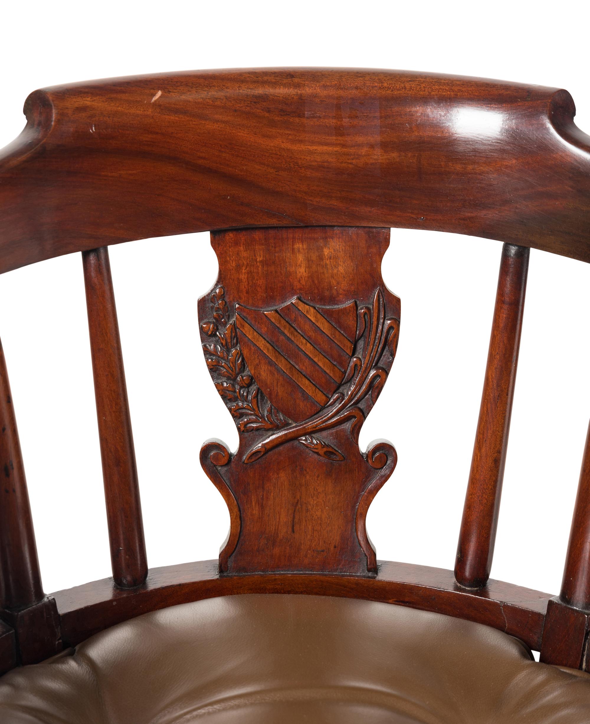 A Pair of English Mahogany and Leather-Upholstered Desk Chairs