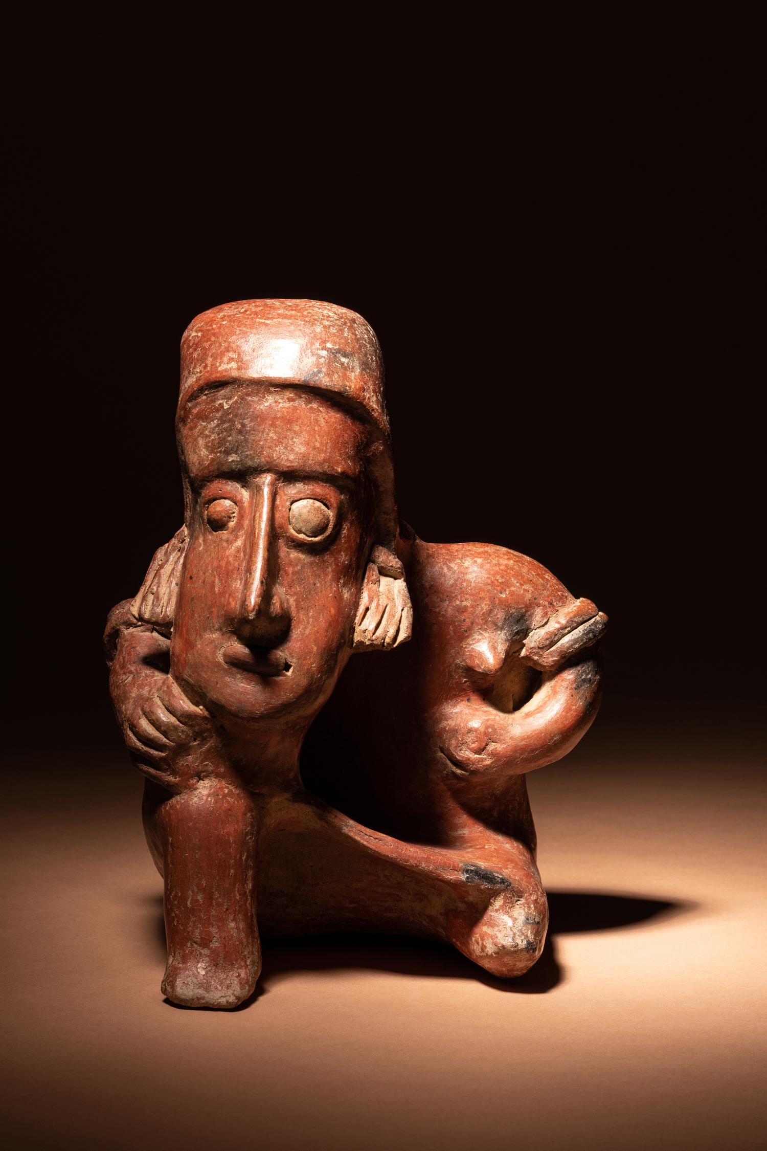A Colima Terracotta Seated Male Figure