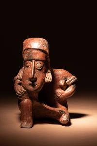 A Colima Terracotta Seated Male Figure