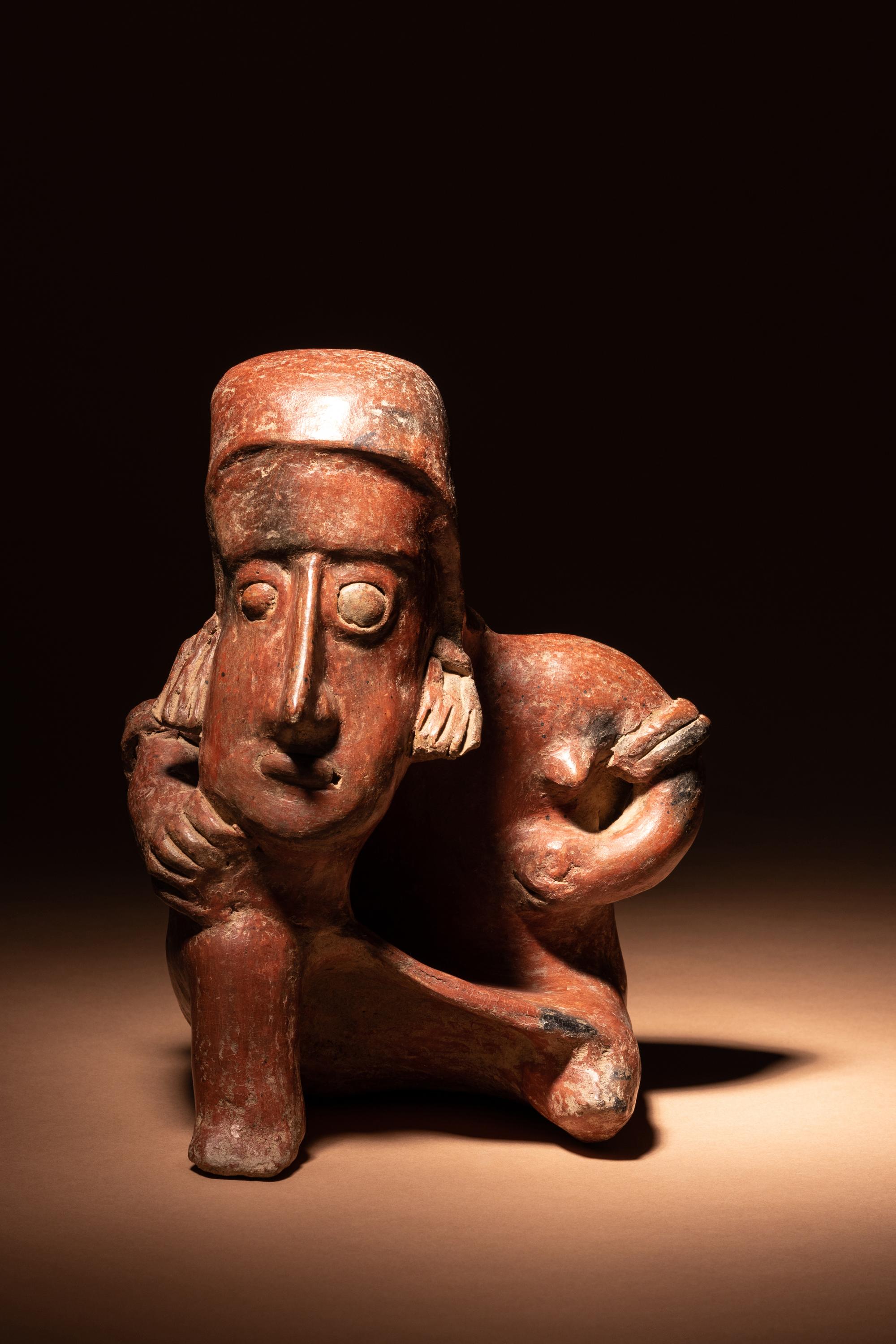 A Colima Terracotta Seated Male Figure