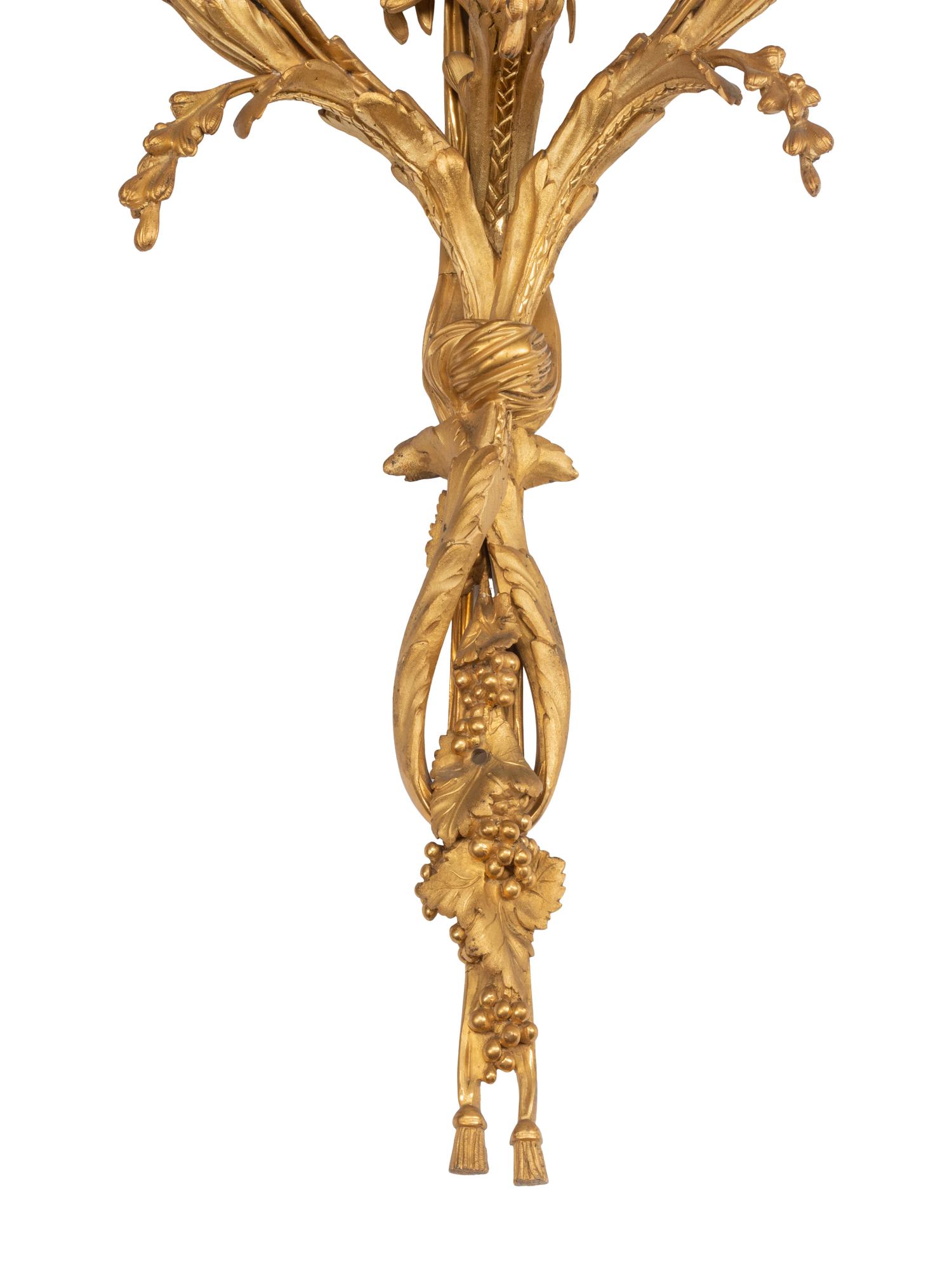 A Pair of Louis XVI Style Gilt Bronze Three-Light Sconces