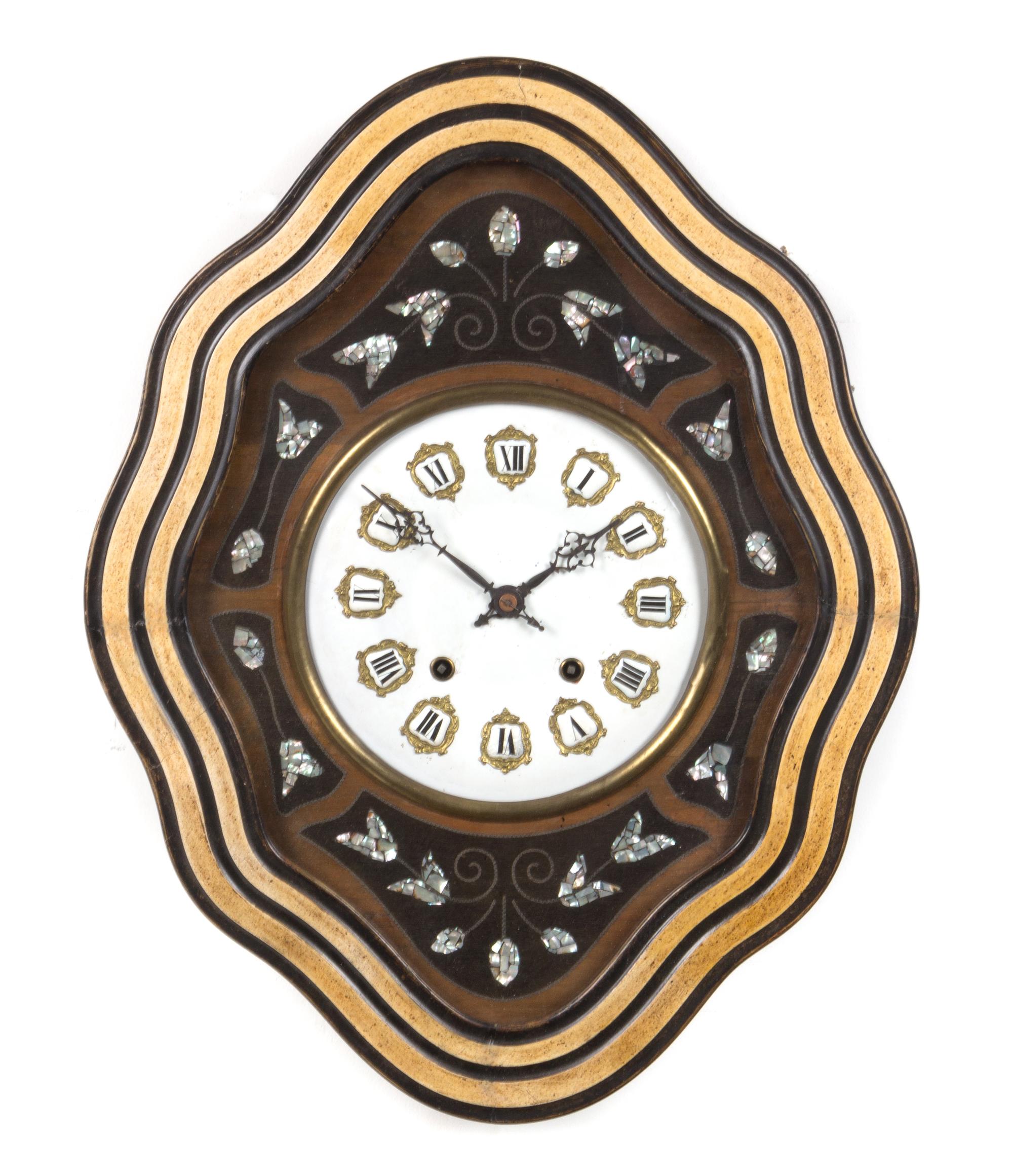 A French Ebonized Wall Clock Height 21 inches.