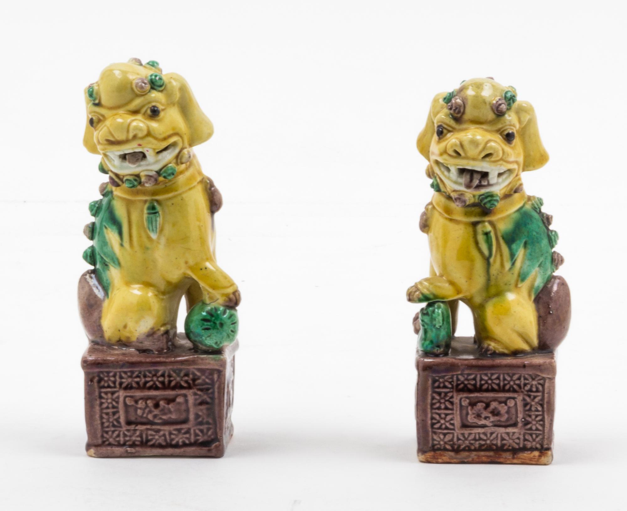 A Pair of Sancai Glazed Porcelain Figures of Fu Lions Height of tallest 5 3/4 inches. — 19TH CENTURY