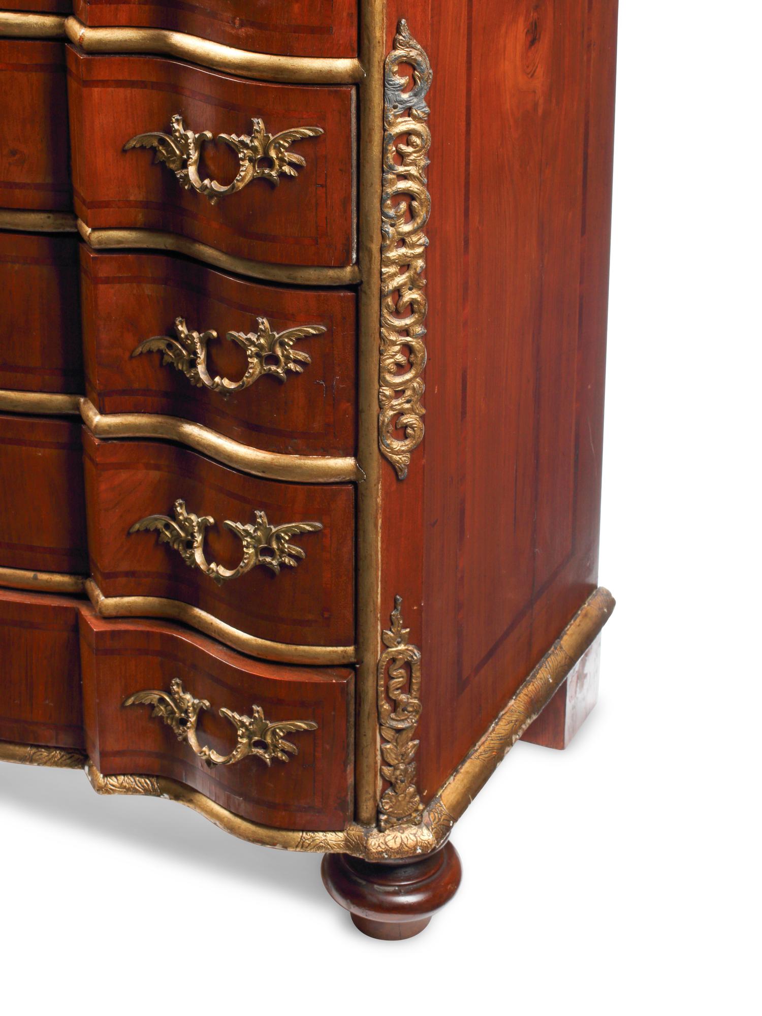 An Italian Parcel-Gilt Fruitwood Tall Chest of Drawers