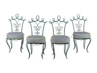 A Painted Iron Glass-Top Table and Chairs in the Style of Rene Prou