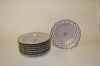 A Set of Eight Limoges Porcelain Plates Diameter 10 1/4 inches.