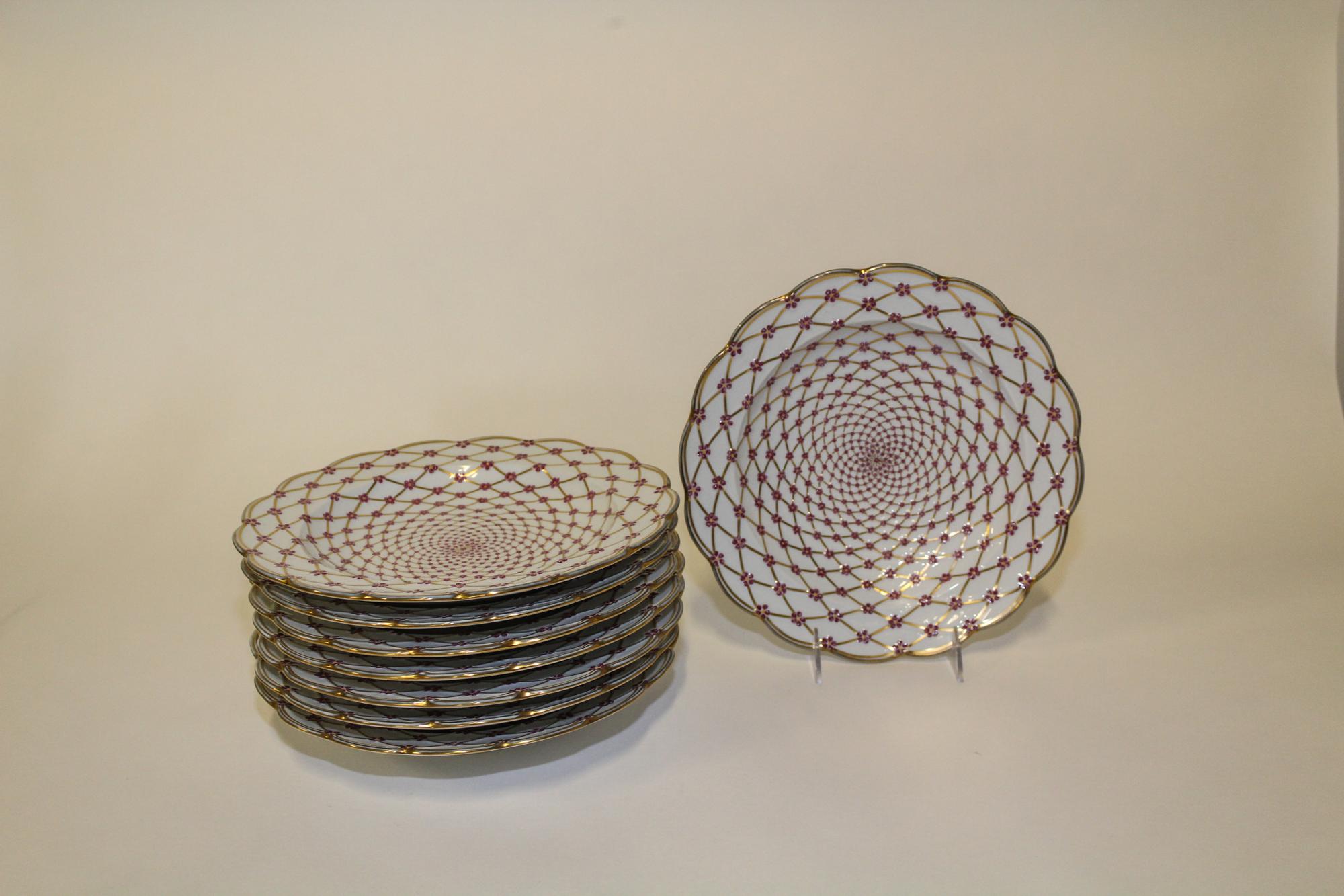 A Set of Eight Limoges Porcelain Plates Diameter 10 1/4 inches.