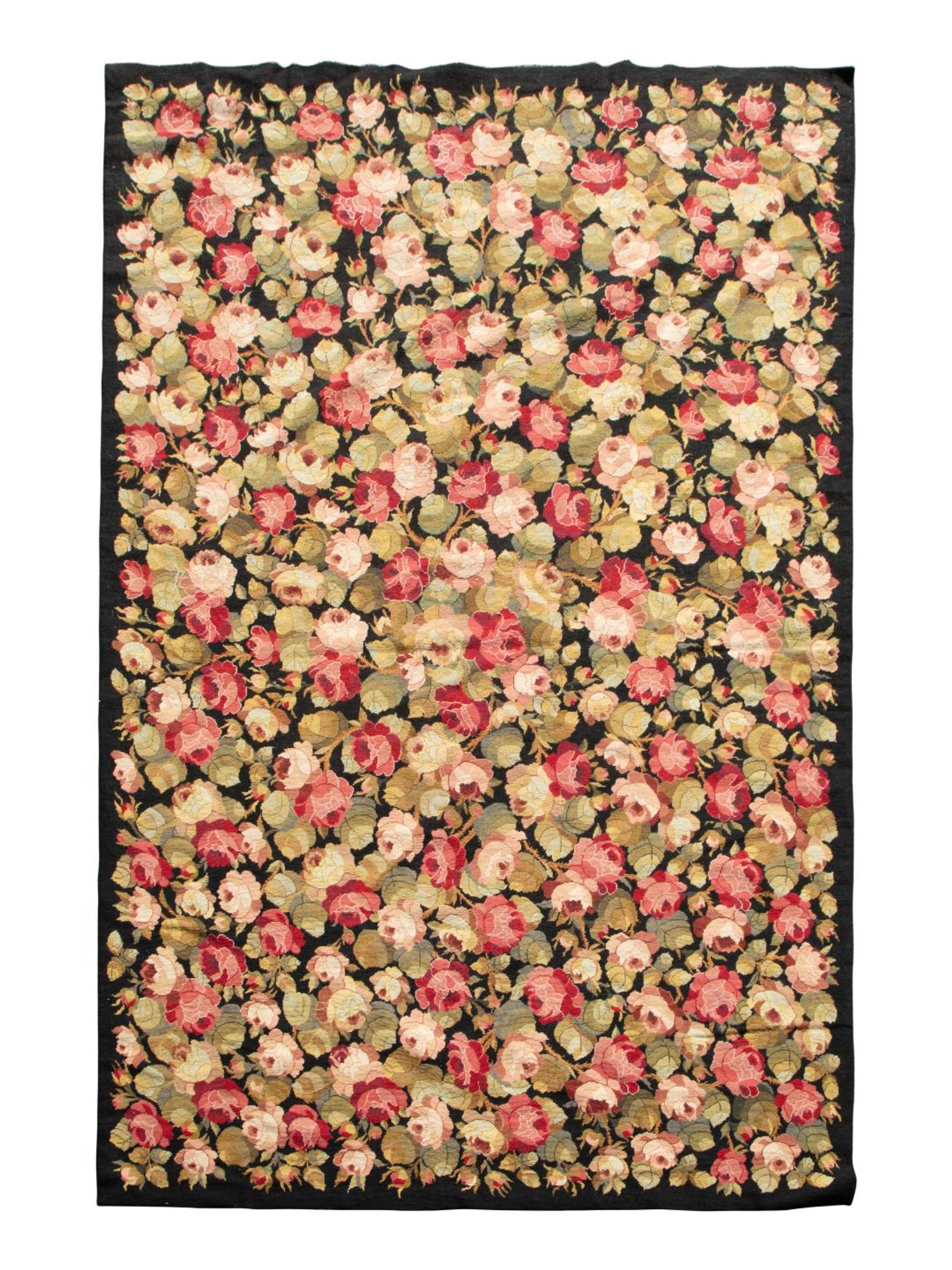 A Needlework Floral Design Rug — 20TH CENTURY