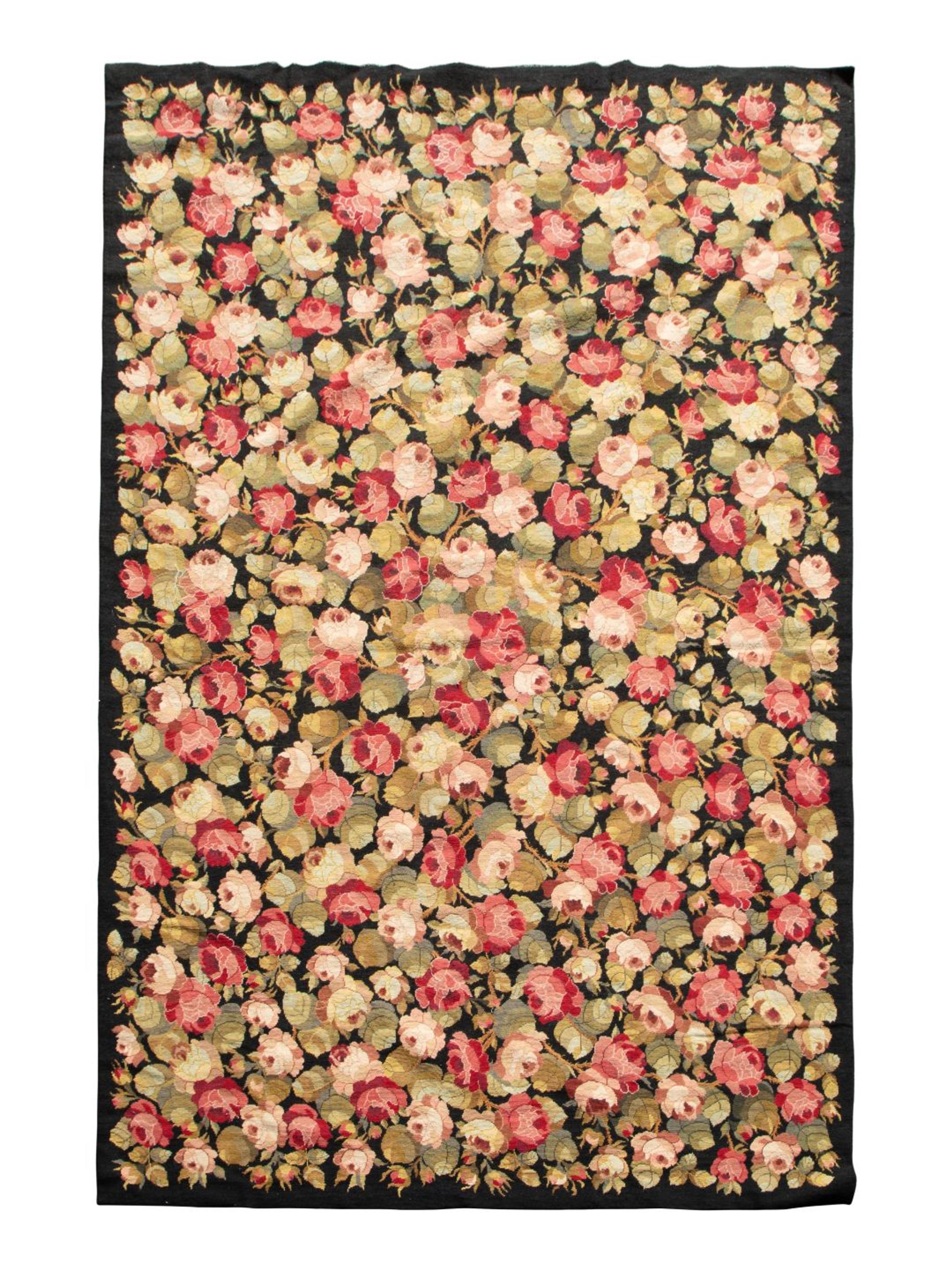A Needlework Floral Design Rug — 20TH CENTURY