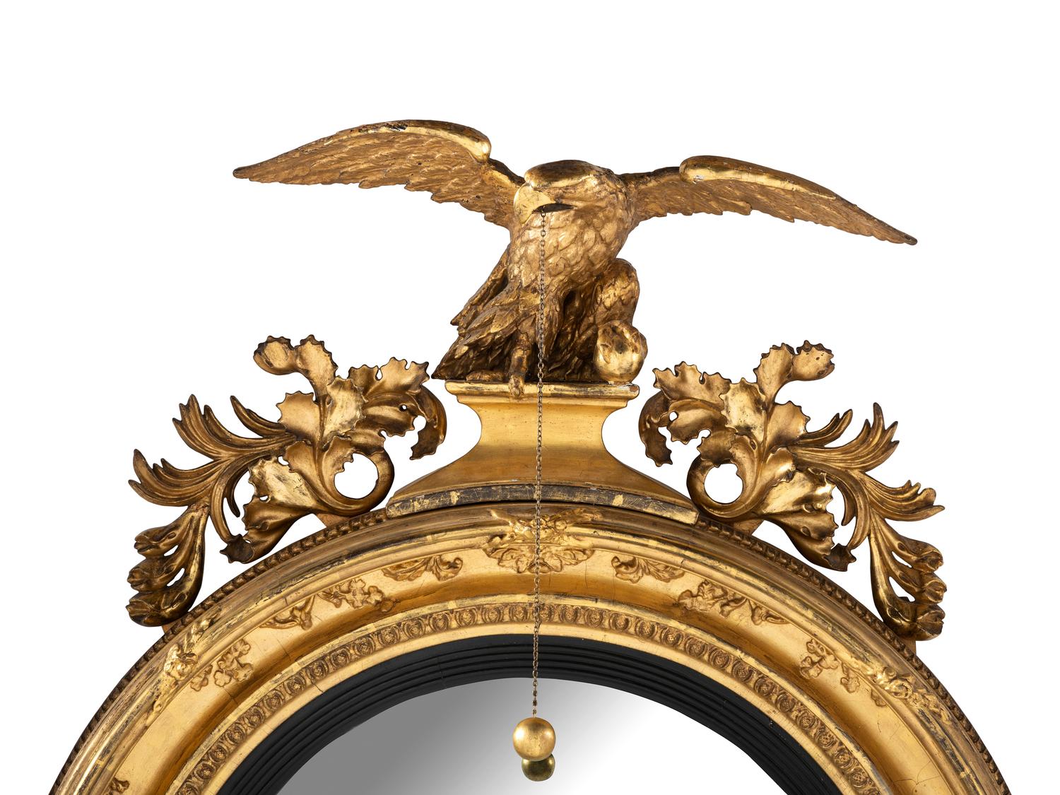 A Large Federal Carved Giltwood and Gesso Bull's-Eye Looking Glass