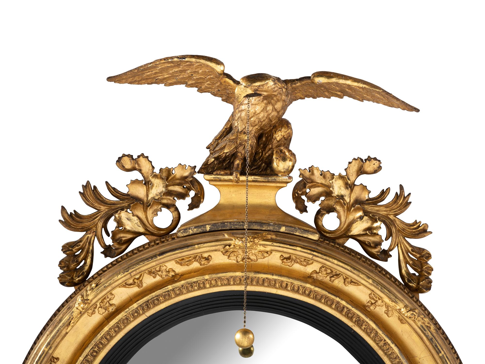 A Large Federal Carved Giltwood and Gesso Bull's-Eye Looking Glass