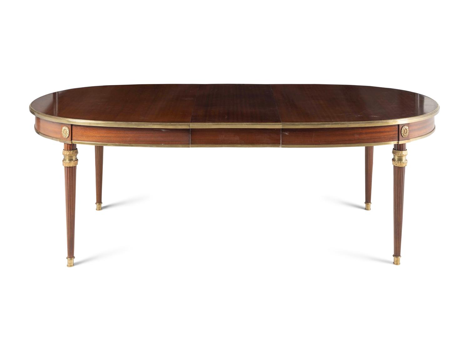 A Louis XVI Style Gilt Bronze Mounted Mahogany Dining Table
