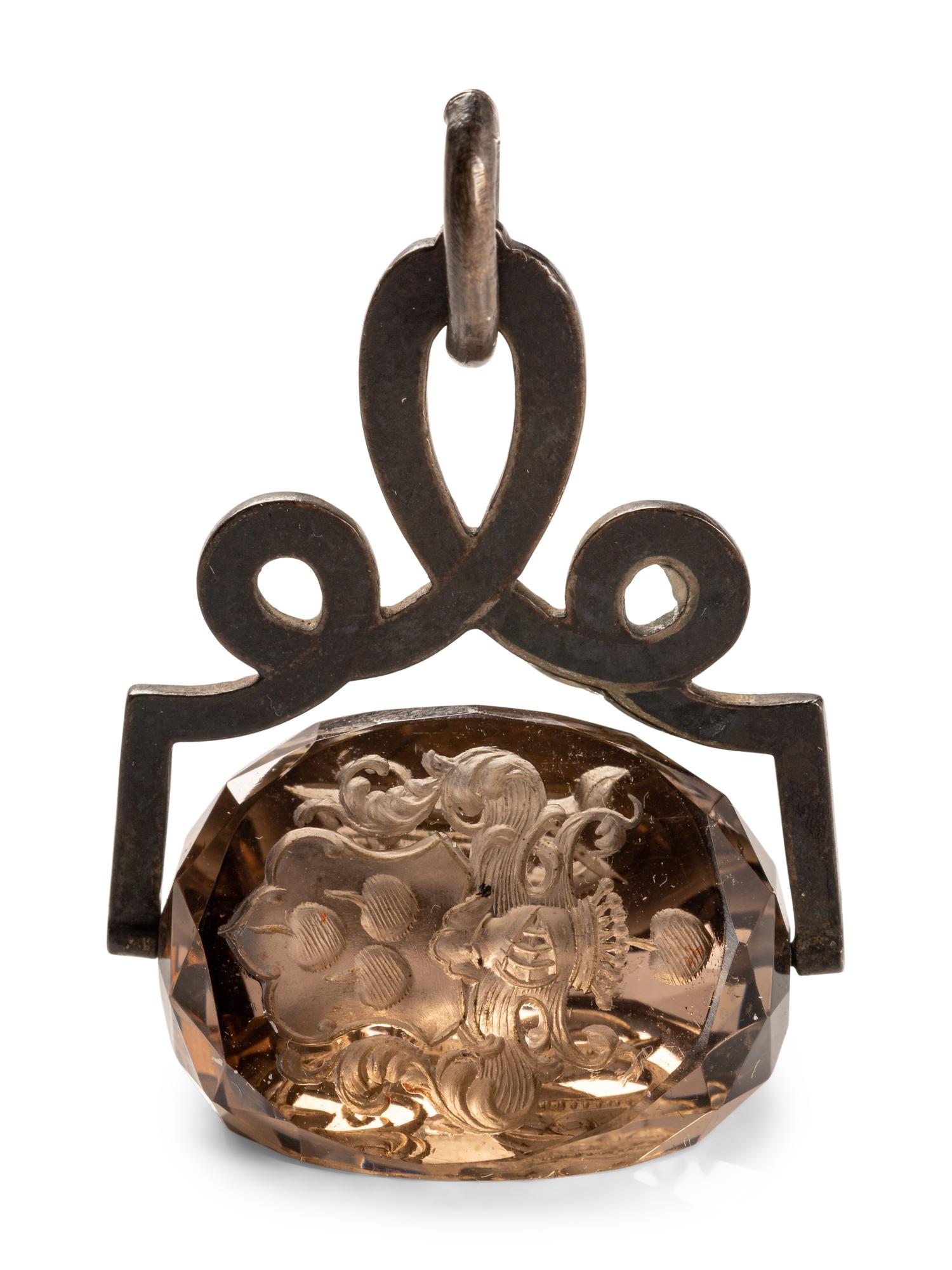 A German Carved Topaz and Gilt Metal Mounted Hand Seal