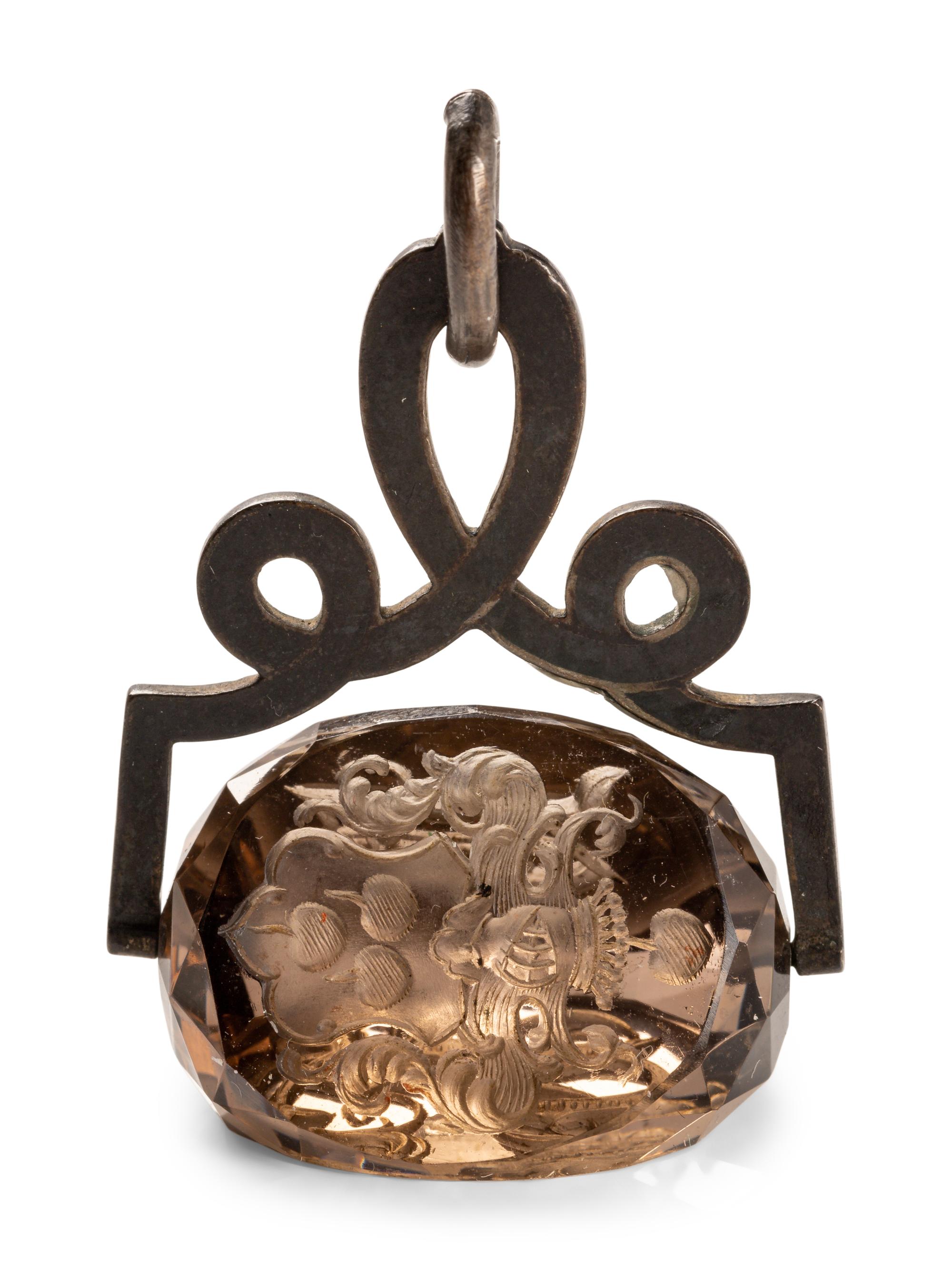 A German Carved Topaz and Gilt Metal Mounted Hand Seal